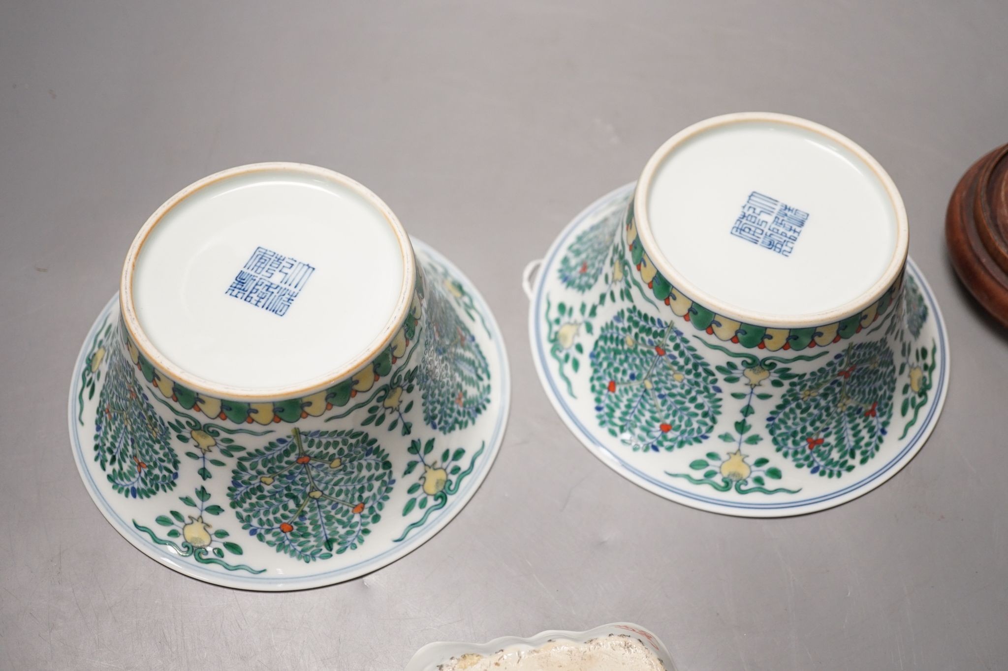 A Chinese blue and white bowl, Kangxi, 15cm. diam., a famille rose teapot stand, Yongzheng, and two doucai bowls